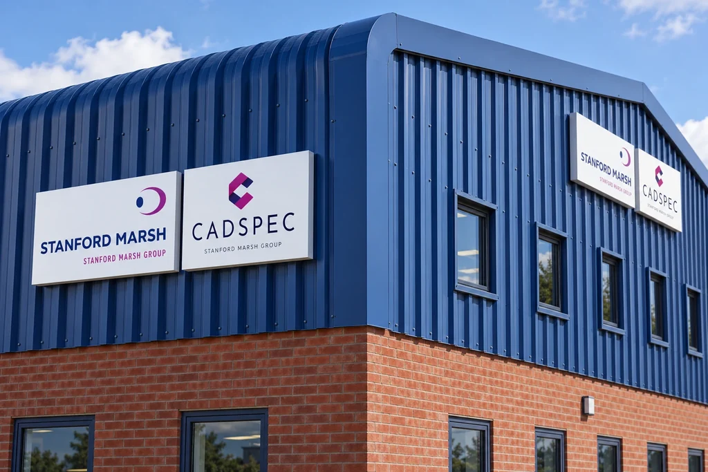 White composite sign trays with vinyl lettering mounted on blue industrial cladding